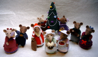 knitted toys of mice dressed in Dickensian christmas costumes