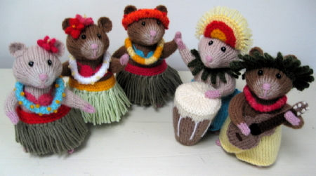 knitted toys of hamsters dressed in traditional Polynesian costumes