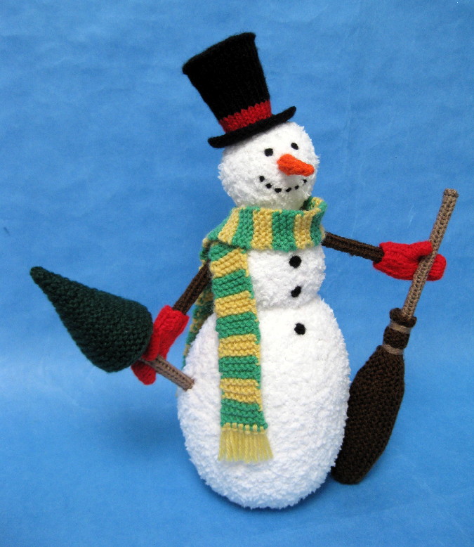 knitted toy of a snowman dressed up with hat and scarf