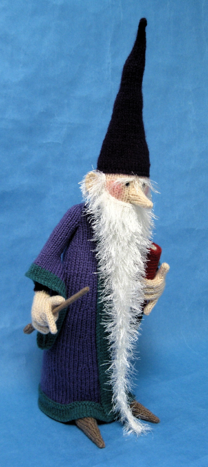 knitted toy of a wizard with a long beard and tall hat