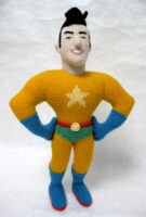 knitted toy of a square jawed super hero