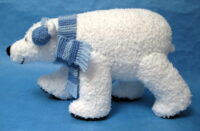 polar bear knitted toy with scarf and ear warmers