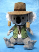 knitted toy of a koala dressed in a cork hat