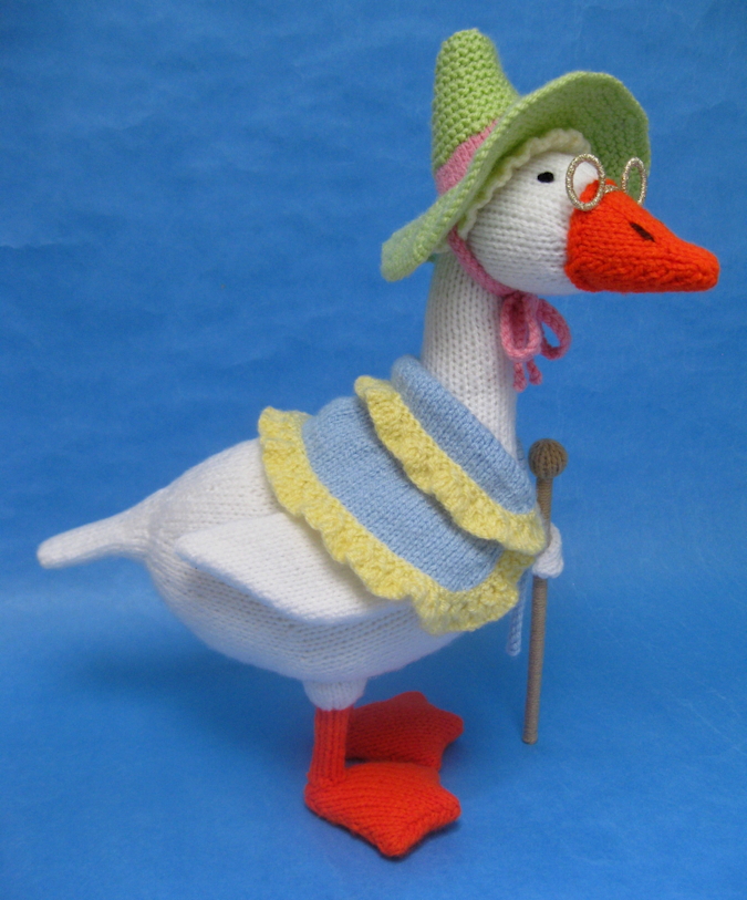 knitted toy of a goose in a bonnet and shawl