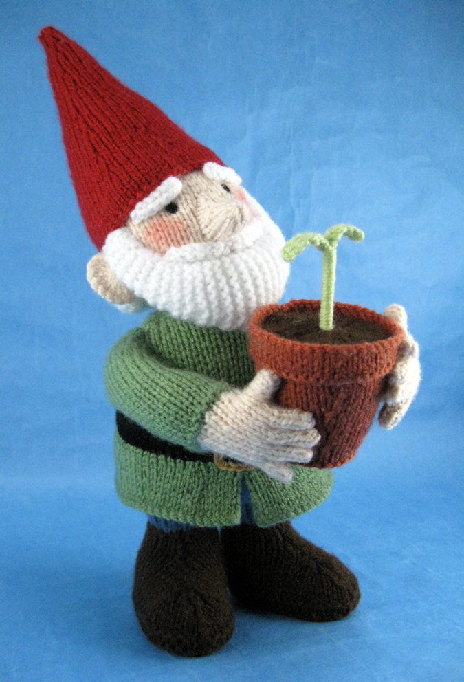 knitted toy of a gnome with a plant in a flower pot