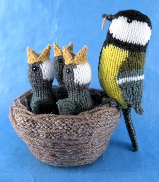 a knitted Great Tit with her nest and brood