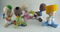 Knitted toys of naughty babies