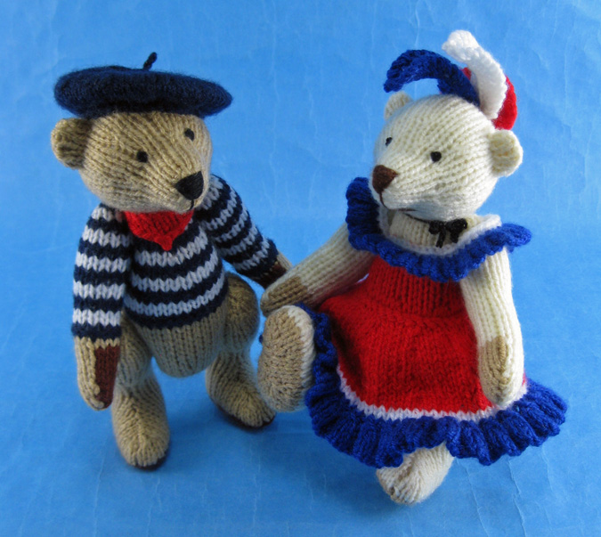 Knitted toys of bears dressed in French outfits