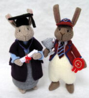 Knitted toys of academic looking bunny rabbits