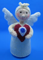 knitted toy of an angel holding a heart