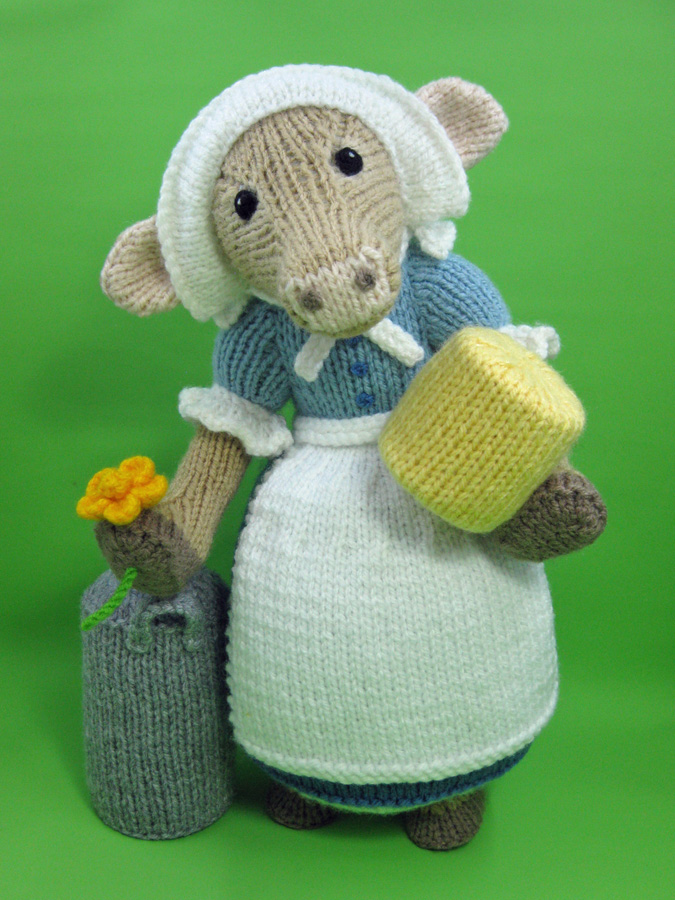 Knitted toy showing Clara the cow milkmaid