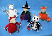 knitted toys of hamsters in Halloween costumes