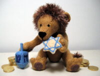 knitted toy of a lion with a star of David