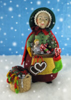 knitted toy of older woman selling toys and sweets