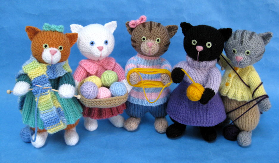 knitted toys of kittens with their knitting