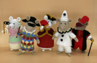 a group of mice knitted toys dressed as Commedia dell'arte players