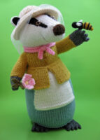 knitted toy of a badger dressed as a beekeeper