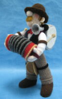 knitted toy of a one man band