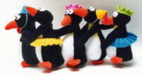 penguin knitted toys doing the conga