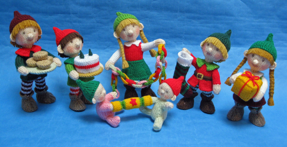 knitted toys of a group of children dressed as Santa's elves