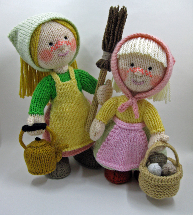 knitted toys of 2 Scandinavian looking rustic women with eggs, kettle and a broom